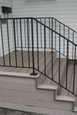 Лестница с перилами из металла на крыльцо