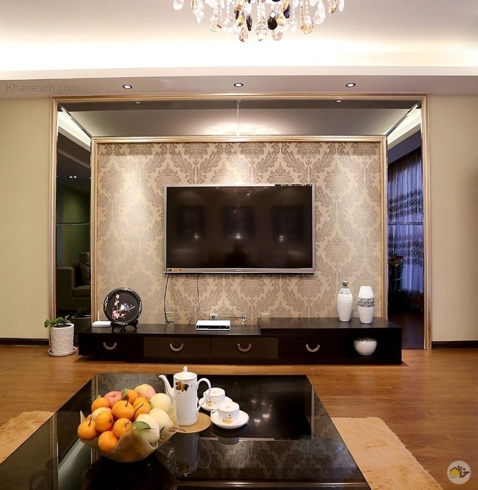 Декоративный камень в интерьере гостиной с телевизором