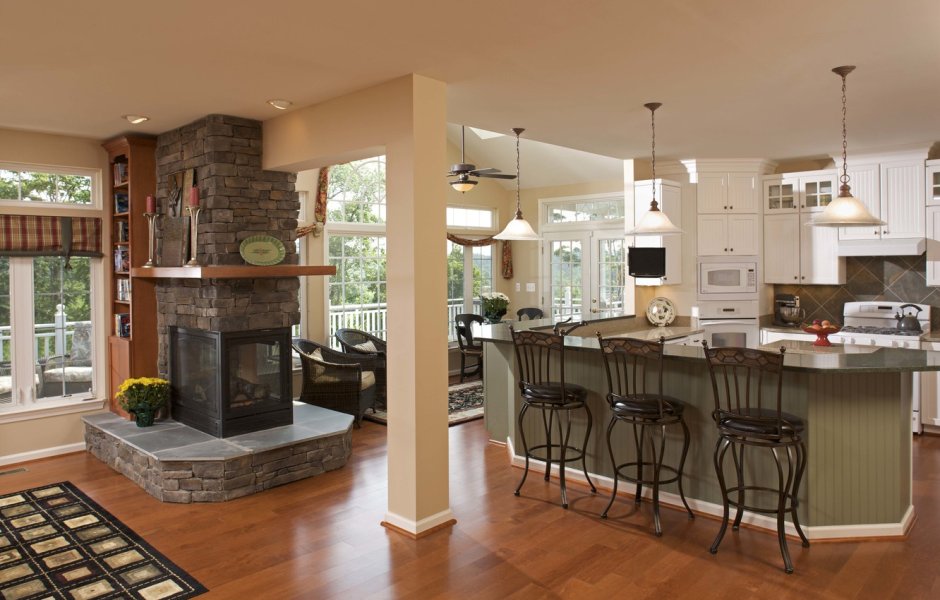 Интерьер кухни+ столовая+ гостиная с камином