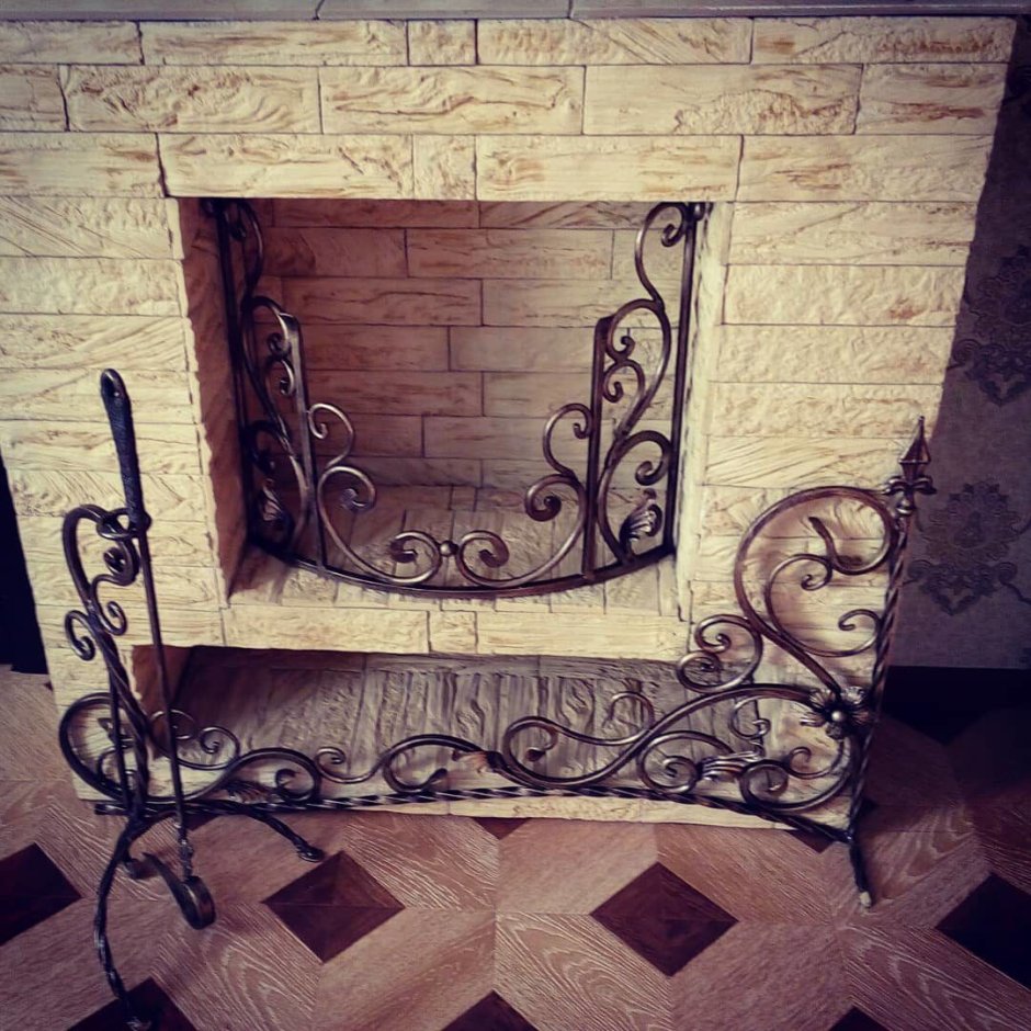 Обрамление камина ковкой