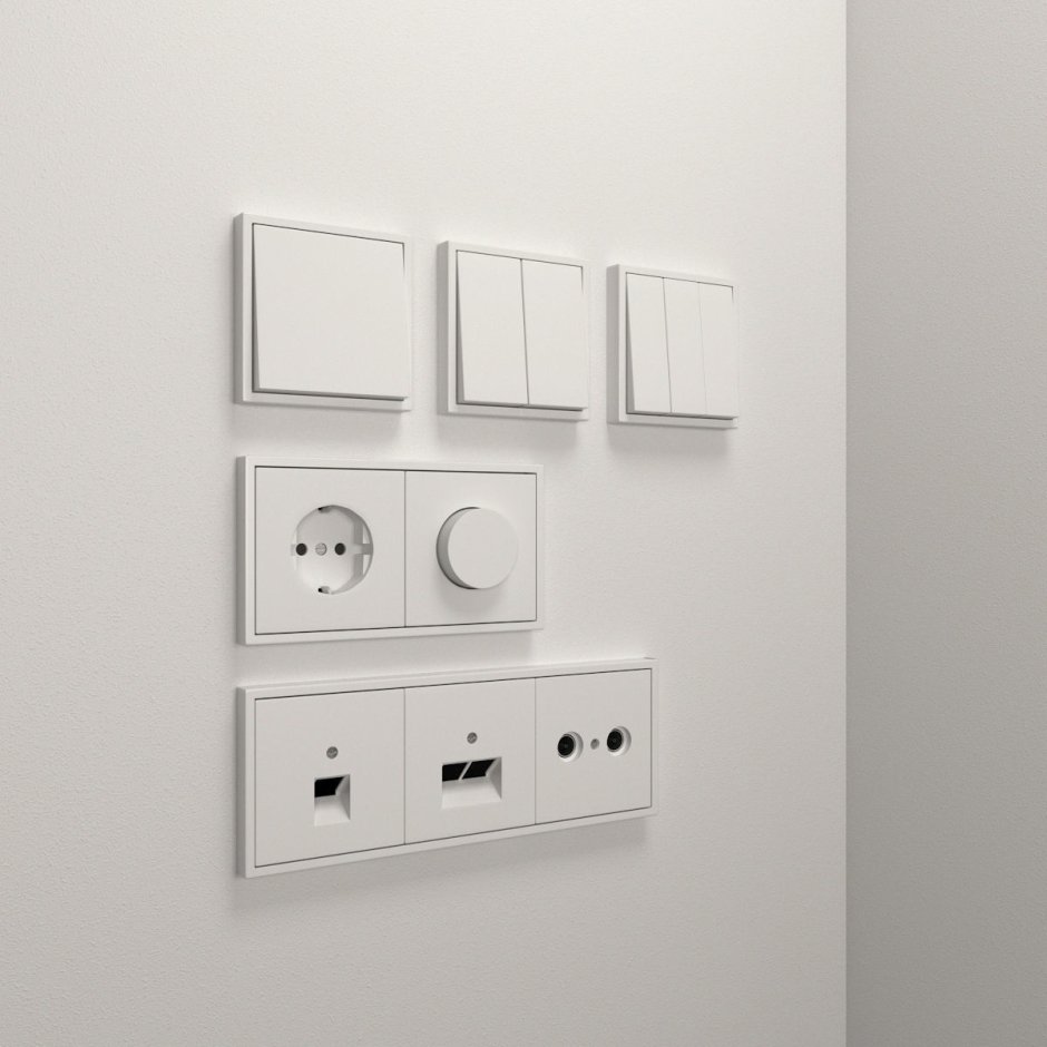 Белые выключатели на белой стене
