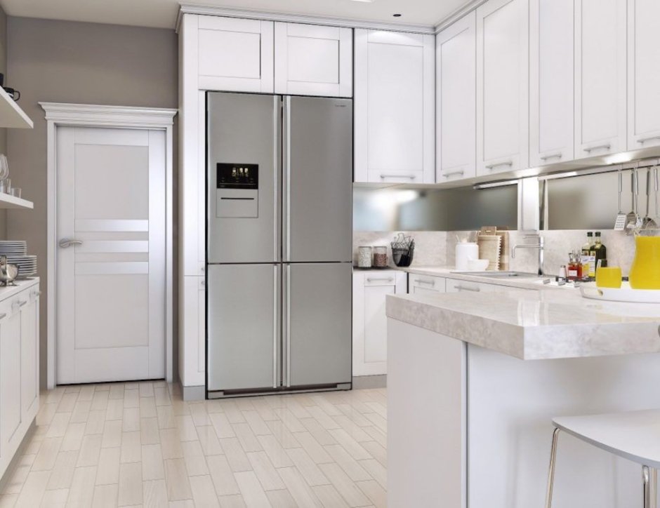 Белый двухдверный холодильник в интерьере кухни