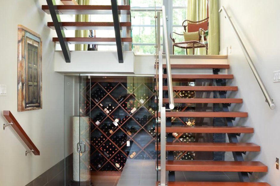 Винный шкаф под лестницей